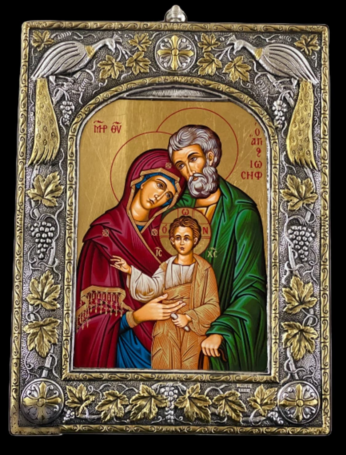 Icon of the Holy Family in an ornate sterling silver frame with gilded vine leaves